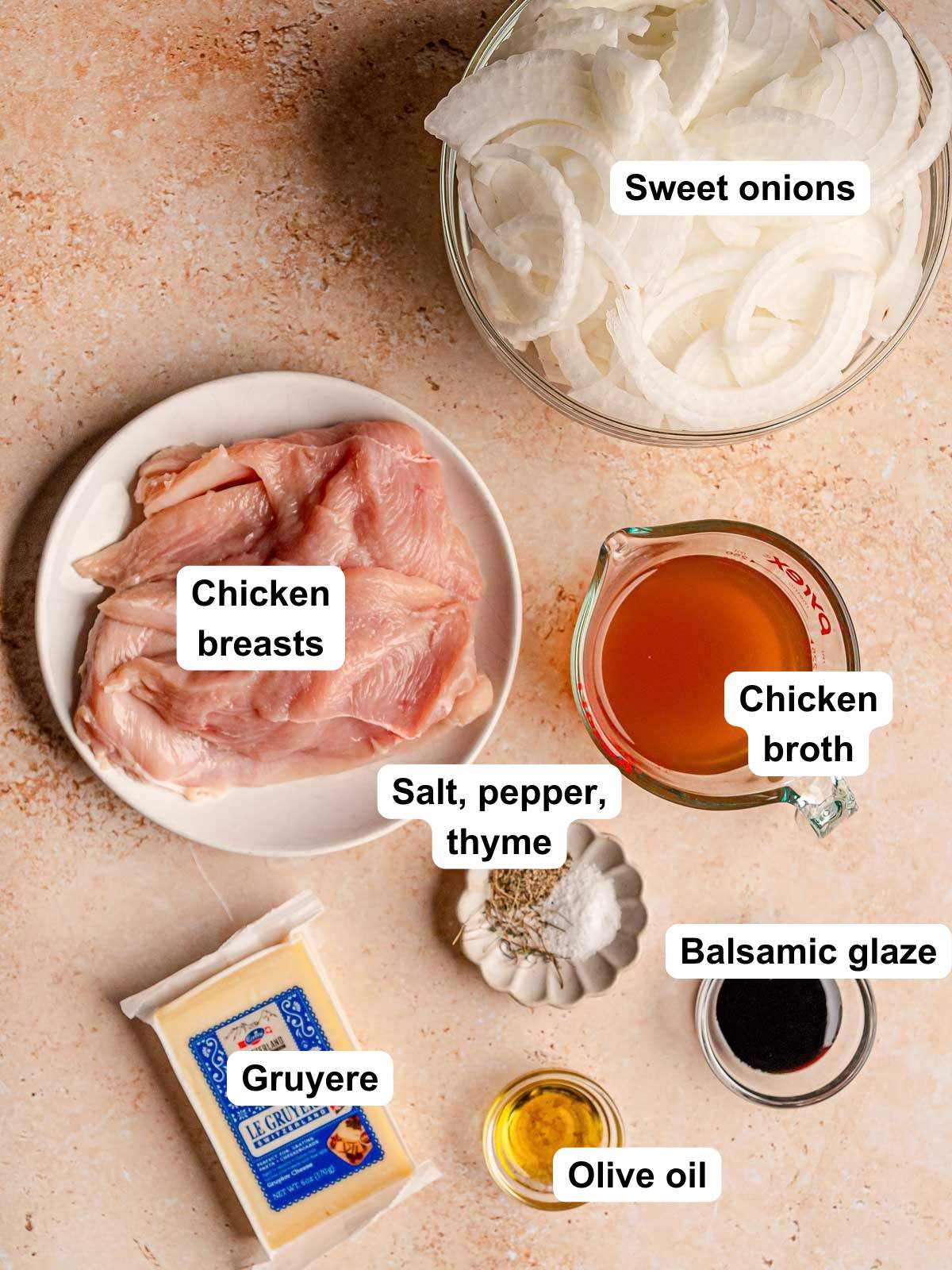 Labeled ingredients for French onion chicken bake: chicken breasts, sweet onions, broth, Gruyère, balsamic glaze, olive oil, salt, pepper, and thyme.